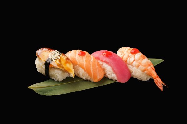 nigiri-sushi-set-nigiri-eel-salmon-tuna-shrimp-banana-leaf-japanese-food-isolated-black-background-japanese-menu
